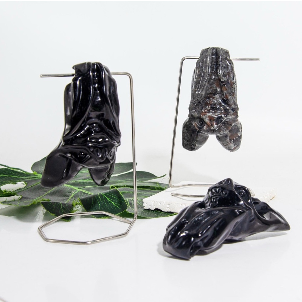 Carved Yooperlite crystal inverted bat with stand